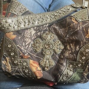 Embellished camouflage purse.
